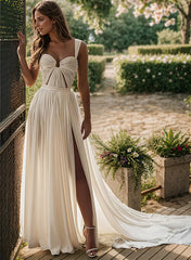 Elegant chiffon wedding dress with pleated bodice and thigh-high slit in outdoor garden setting