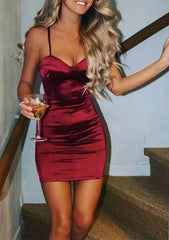 27Dress Satin Homecoming Dress burgundy mini bodycon with spaghetti straps model holding wine glass on stairs