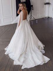 Elegant V-neck Organza Ball Gown Wedding Dress with Ruffles and Sweep Train