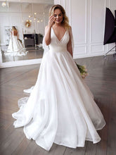 Elegant V-neck Organza Ball Gown Wedding Dress with Ruffles and Sweep Train
