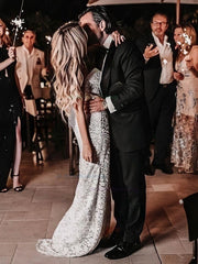 27Dress elegant Lace Wedding Dress worn by bride kissing groom at nighttime celebration