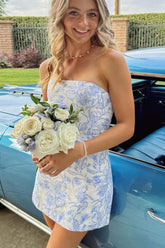 27dress strapless blue and white floral print mini dress holding white rose bouquet by vintage car Floral Homecoming Dresses