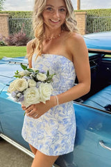 27dress strapless blue and white floral print mini dress holding white rose bouquet by vintage car Floral Homecoming Dresses