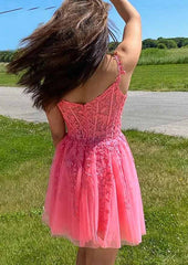 27Dress pink Tulle Homecoming Dress with lace bodice floral appliques spaghetti straps back view outdoors