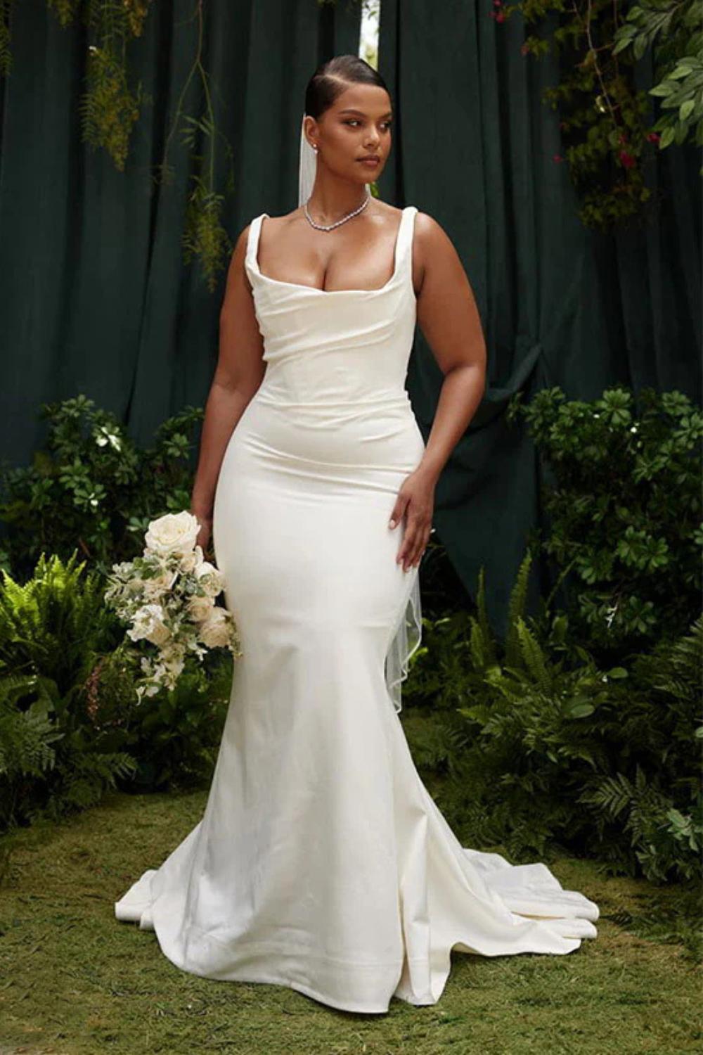 Elegant white satin wedding dress with fitted bodice and flowing skirt by 27dress