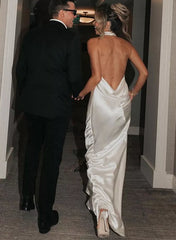 Elegant backless sheath wedding dress by 27dress with satin finish and low draped design