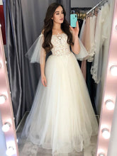 Timeless Elegance: Ball Gown Off-the-Shoulder Tulle Sweep Train Wedding Dress with Beading