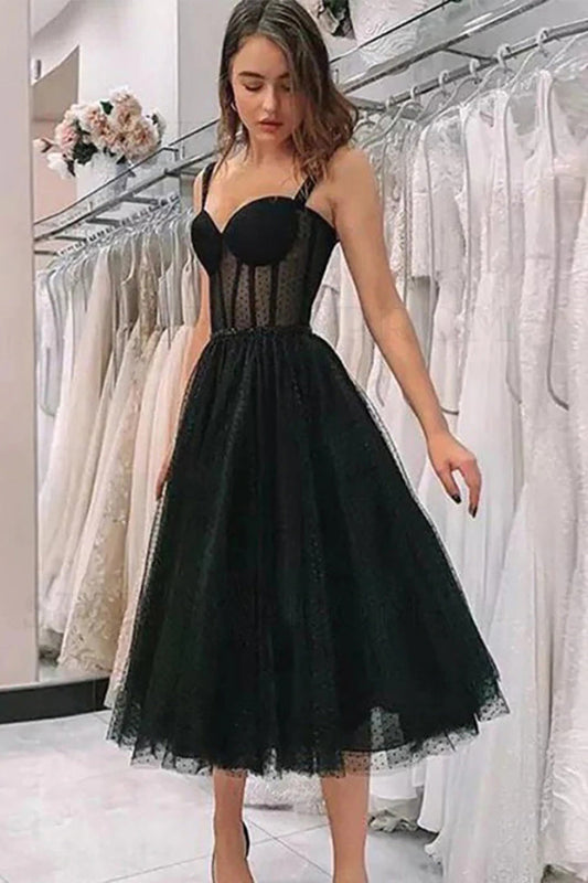 Black polka dot A-line dress for an office holiday party