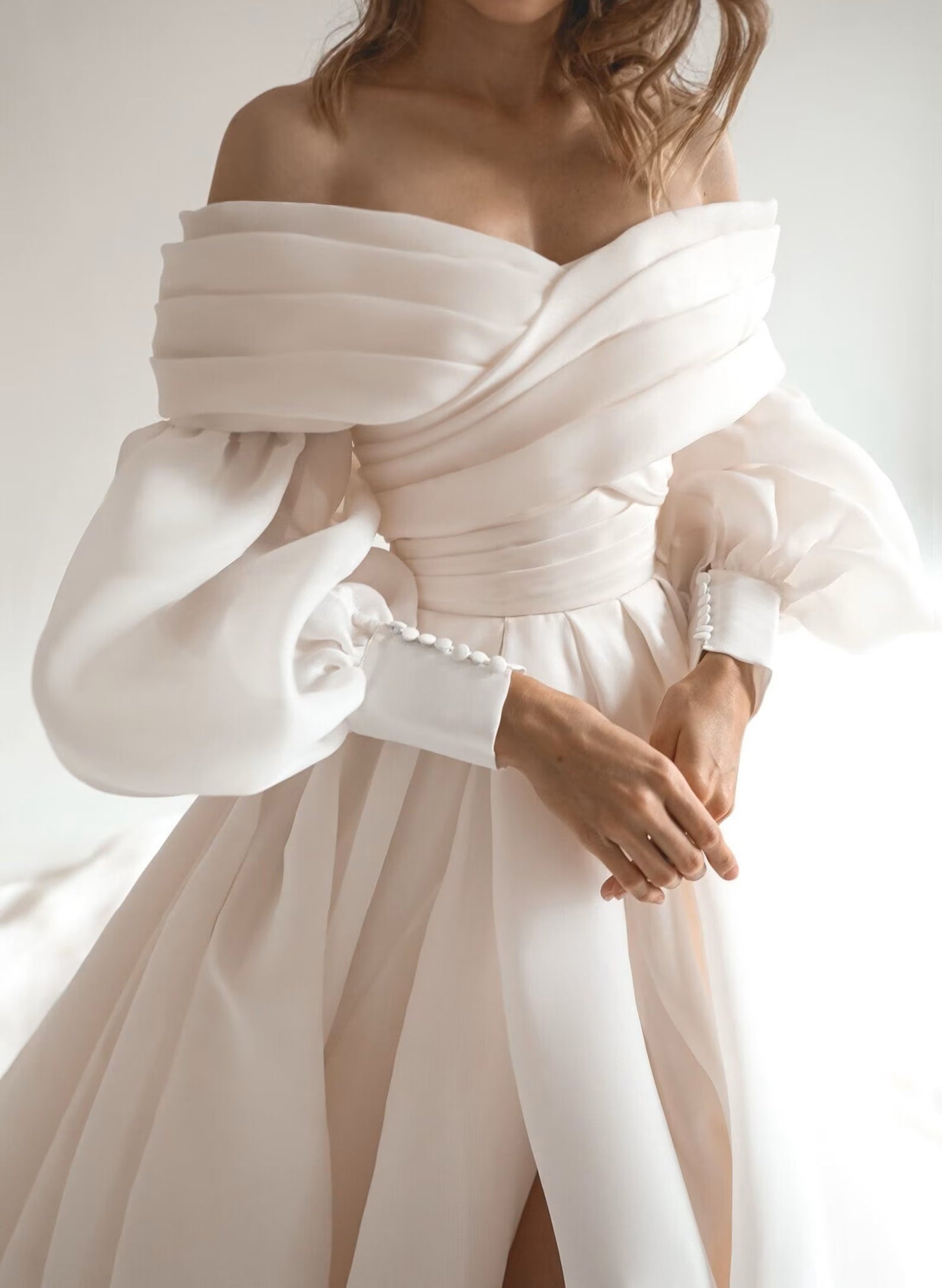Ivory Off The Shoulder Organza A-Line Chapel Train Wedding Dress with Long Sleeves and Slit Bodice Detail