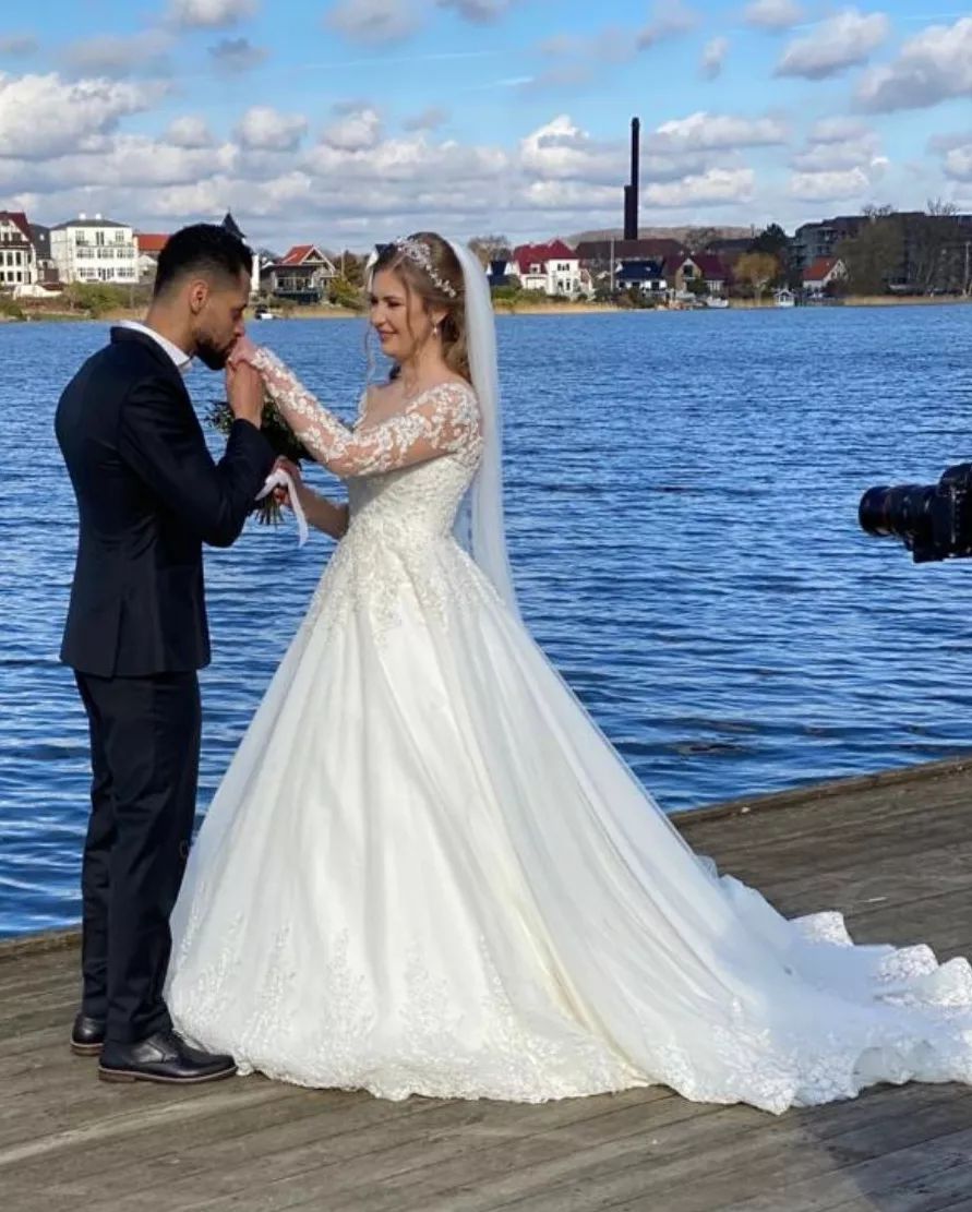 White Scoop Neck Ball Gown Chapel Train Wedding Dress with Lace Appliques and Long Sleeves Side View