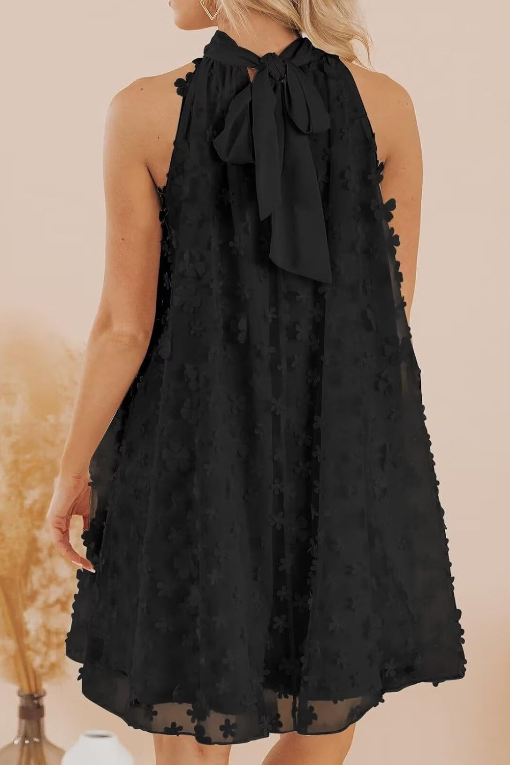 Mini Homecoming Dress black sleeveless halter with bow tie back floral textured A line swing dress