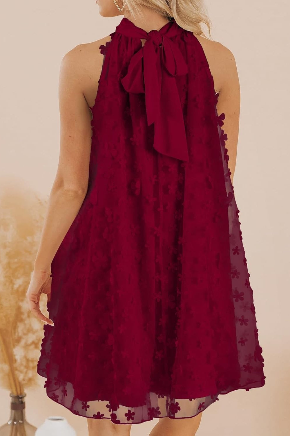 27dress burgundy halter Mini Homecoming Dress back view with neck bow floral textured chiffon overlay