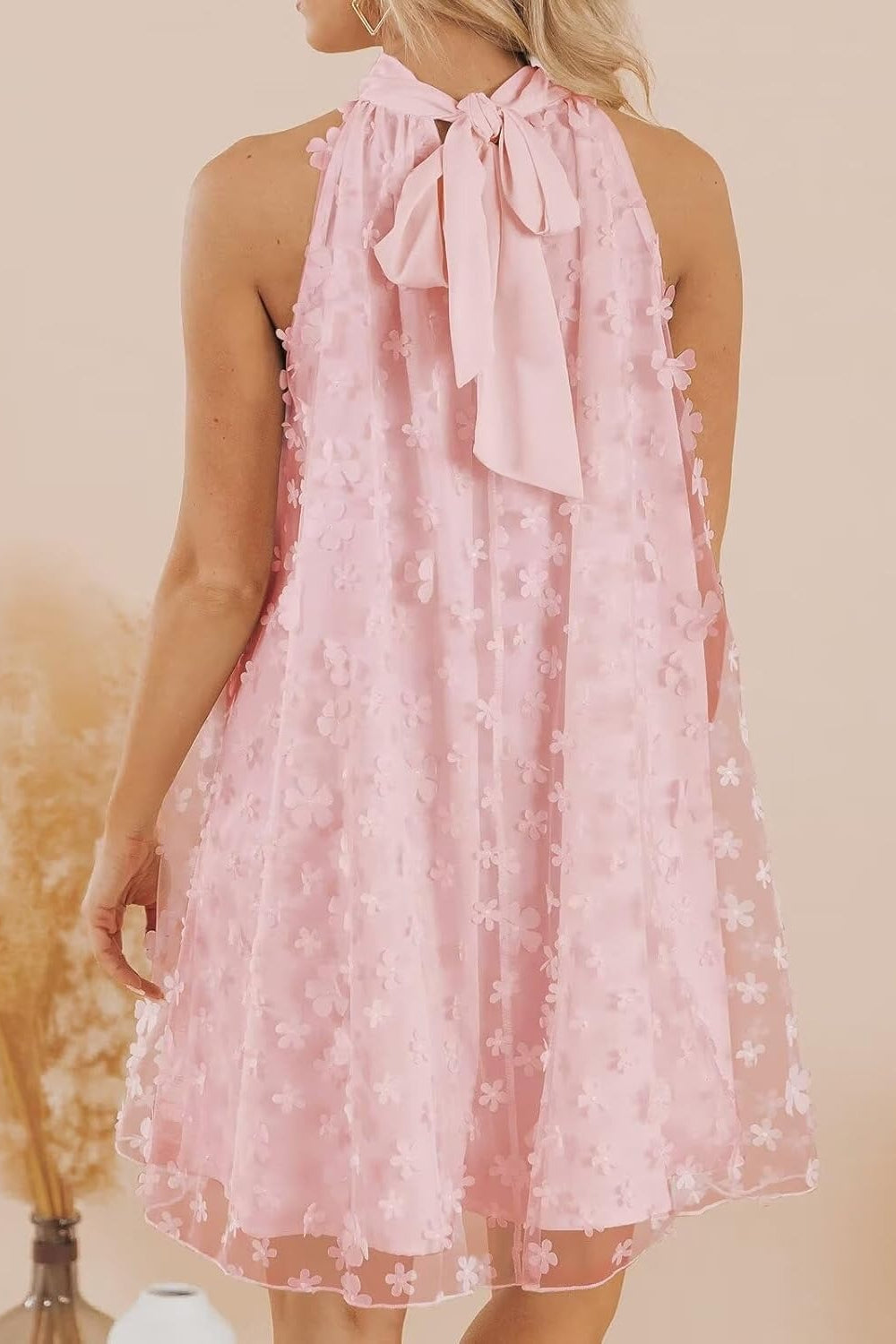 27dress pink halter Mini Homecoming Dress back view with bow tie neck and 3D floral applique overlay