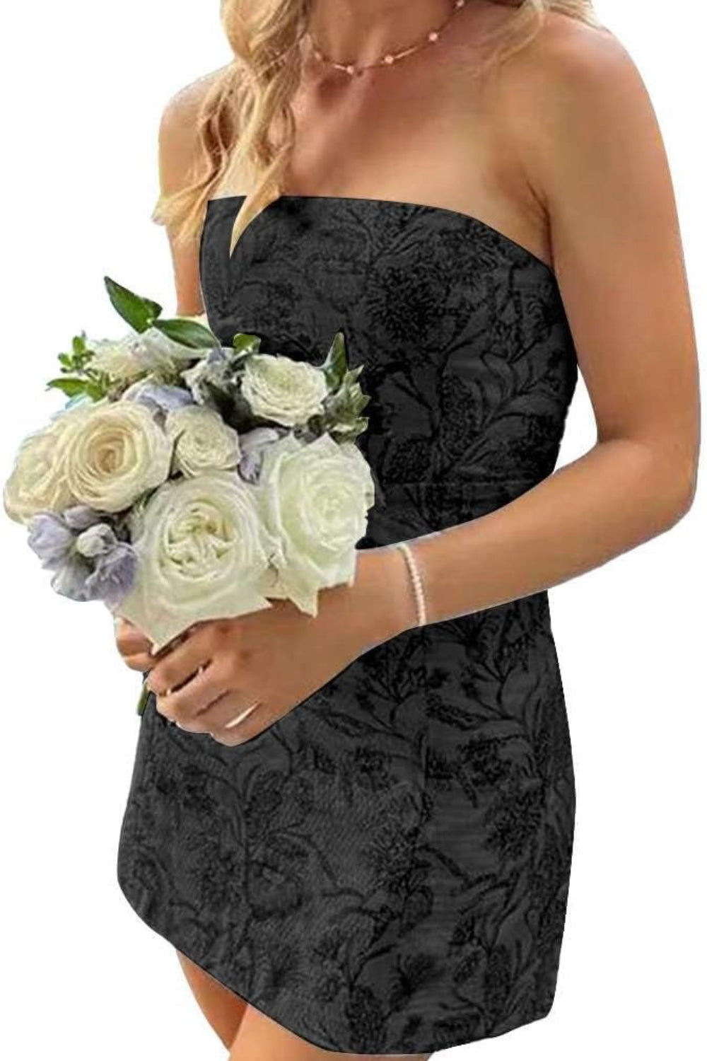 Floral Homecoming Dresses strapless black jacquard mini dress with subtle floral pattern model holding white bouquet