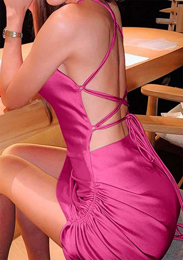 Satin Homecoming Dress fuchsia strappy backless design with ruched side detail seated at table